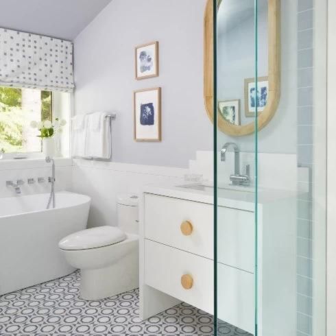White bathroom with shower as part of bathroom renovation trends