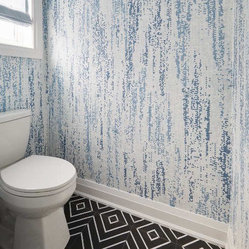 Black ceramic tile and blue wallpaper
