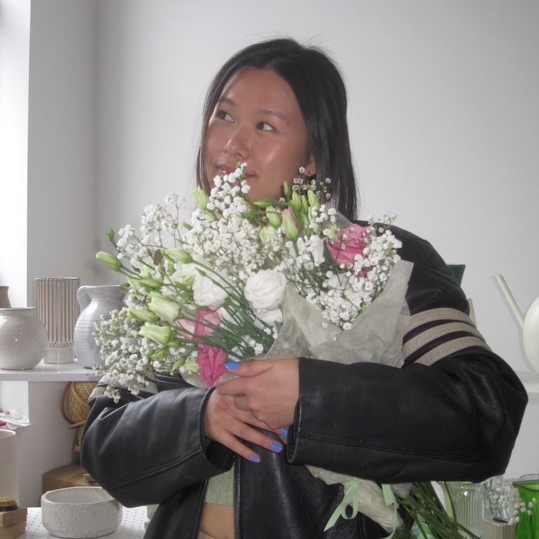 Katrina Huang holding flowers
