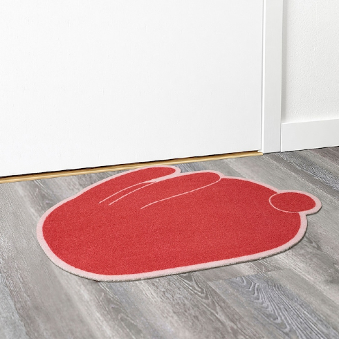 A red rabbit front door mat