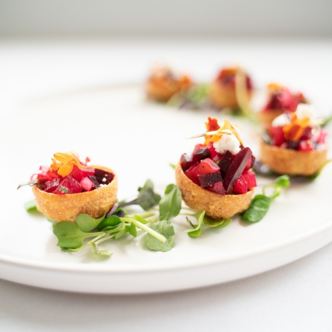 Beet pastries on a white plate.