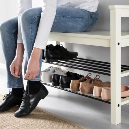 entryway storage ideas: White storage bench with shoes