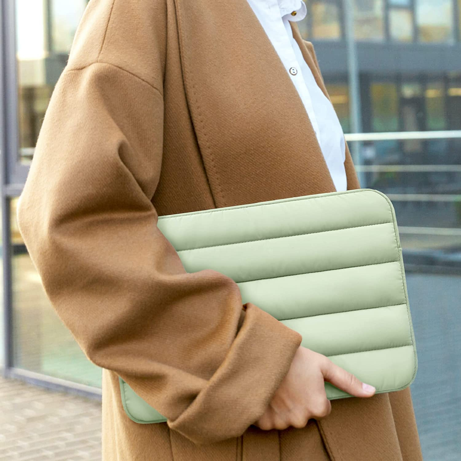 A puffy mint green laptop case