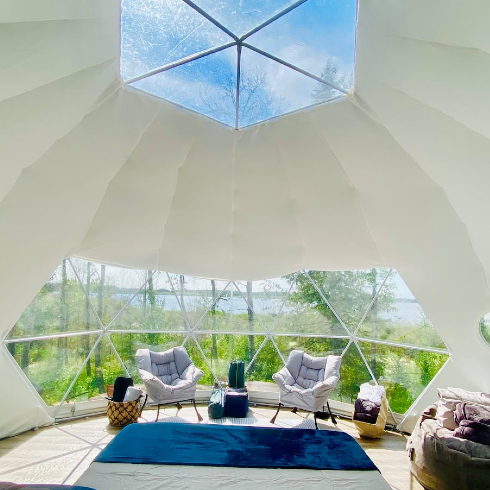 The interior of a luxurious biodome with clear glass sunroof