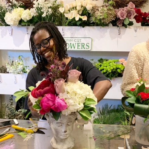 Blooming Flower Bar's Anji Shukla creating a colourful floral arrangement