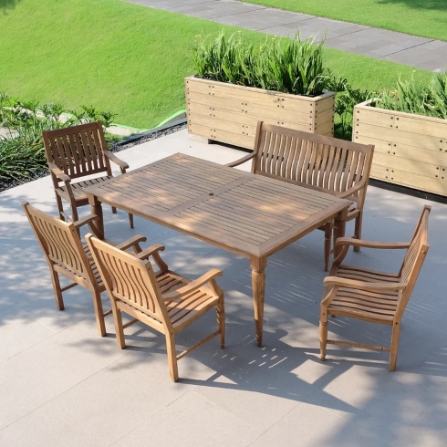 A rectangular teak outdoor dining table with four chairs and a two-person bench