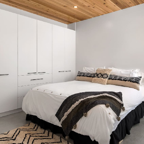 A spacious and clean bedroom in the luxury cabin in Manitoba