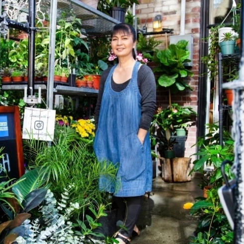 Irene Hickman of Portland Market standing in front of her plant offerings