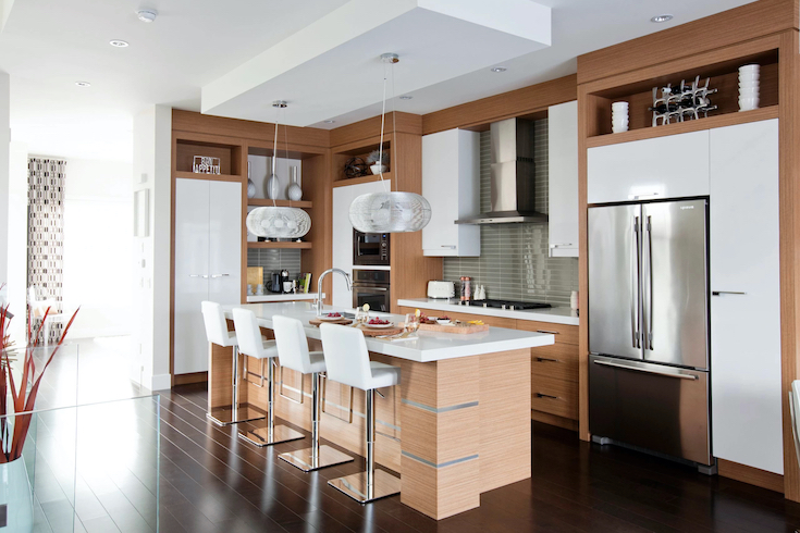 Beautiful modern kitchen that uses two different tones of wood on the floor and in the kitchen cabinets