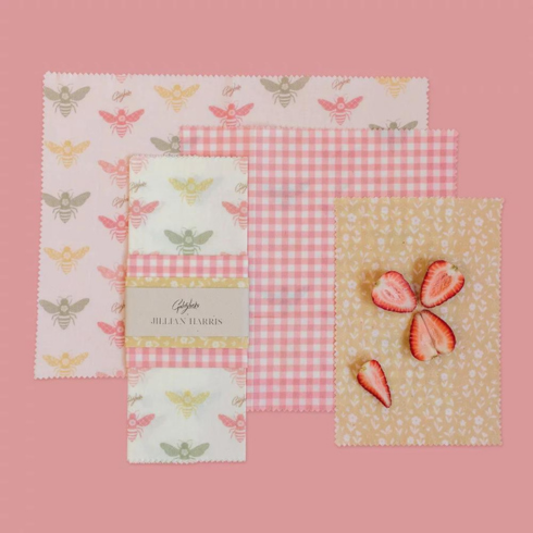 natural beewax wraps in fun patterns on pink background