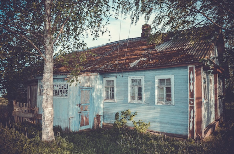Old cottage with blue wood