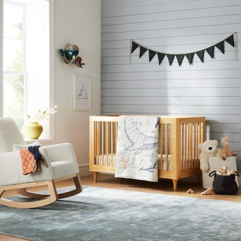 Nursery room with simple wood crib