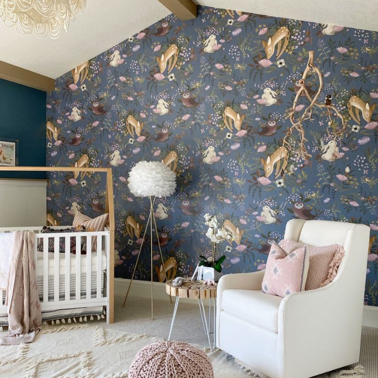 Woodland-themed nursery showing wallpaper