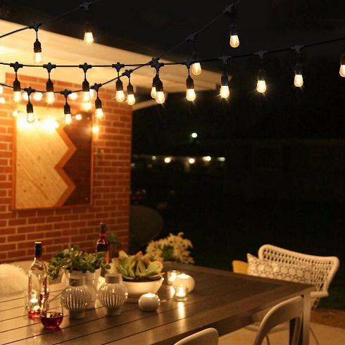 outdoor string lights on a backyard patio