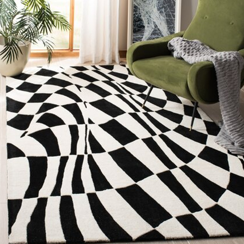 A checkboard rug in a bedroom