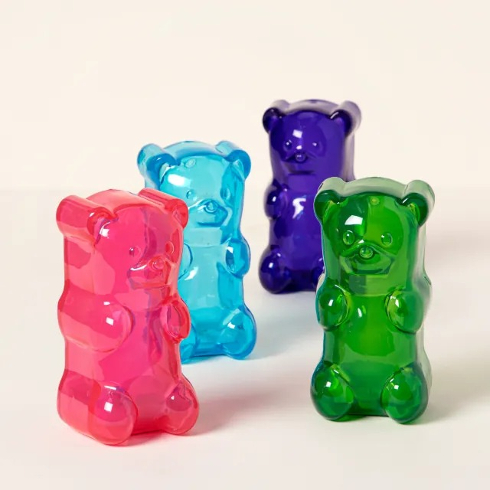 A shot of four brightly-coloured lamps in the shape of a gummy bear