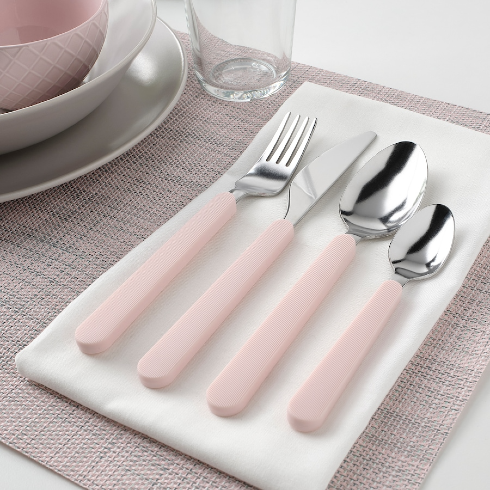 Silver and pink cutlery set laid out on a napkin