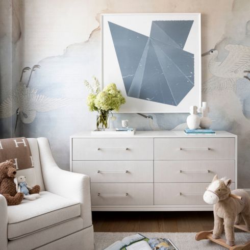 Modern neutral baby boy's nursery with soft blue accents
