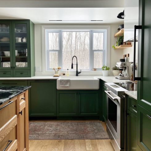 Dark green kitchen with apron sink