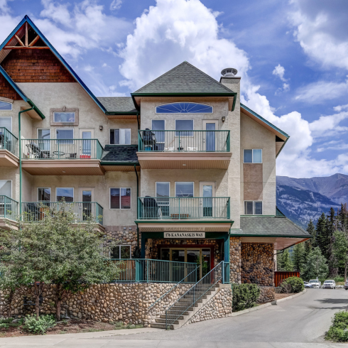 Gorgeous condo building in Canmore with vaulted ceiling and mountain views.