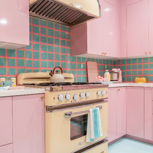 The patterned wallpaper as kitchen backsplash in the Barbie Dreamhouse kitchen