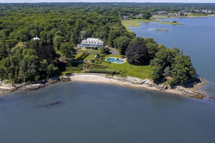 Aerial view of Copper Beach Farm's private peninsula with main house, pool, gardens and private beaches