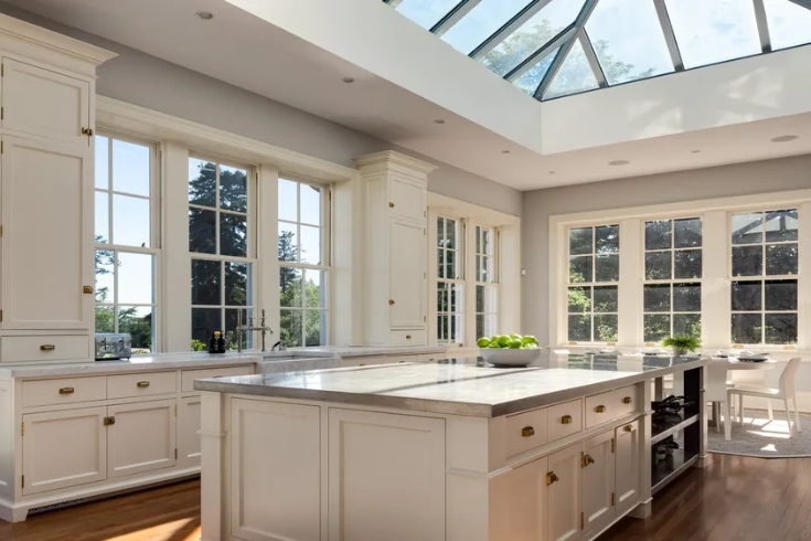Chef's kitchen with ample counter space, island, breakfast nook and large skylight.