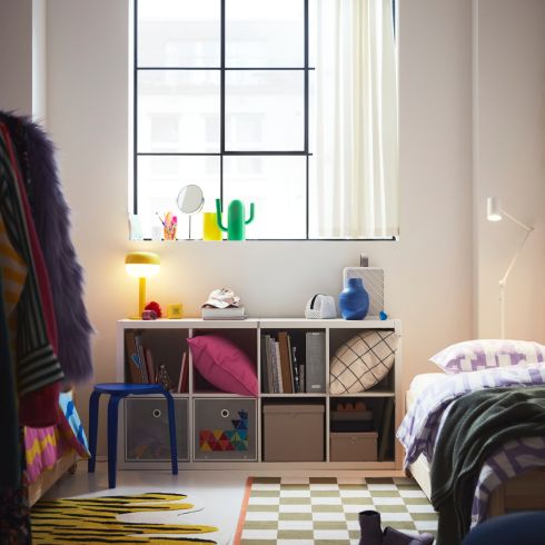 Dorm room with checkered rug