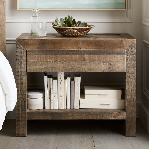A distressed wood bedroom side table