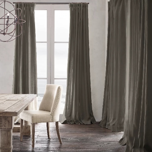 Deep grey heavyweight linen drapes on dining room windows