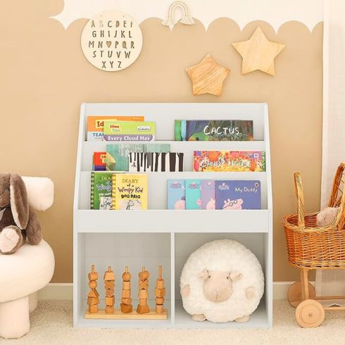 White kids bookcase with built-in storage shelves on bottom.
