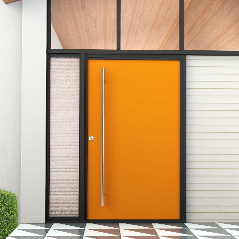 A modern home exterior with a bright orange door