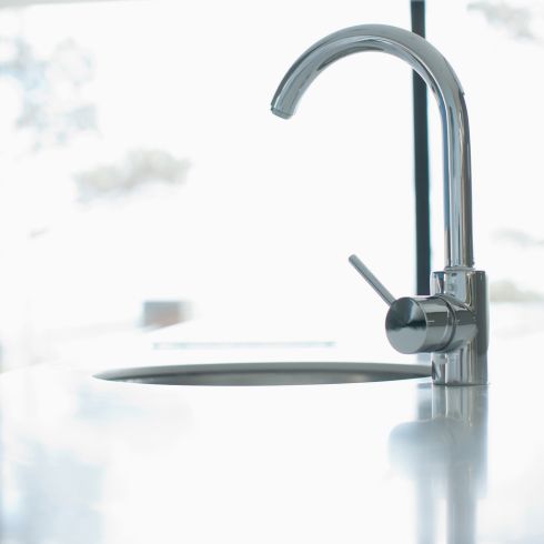 close-up of modern chrome kitchen faucet