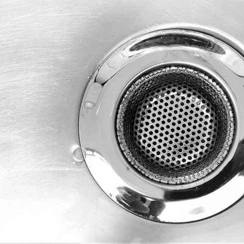 close up of clean chrome kitchen drain