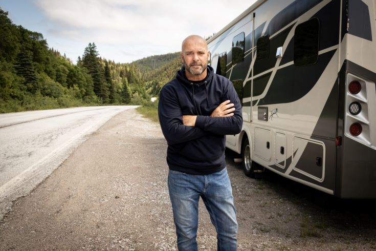 Bryan Baeumler next to his RV for Bryan's All In