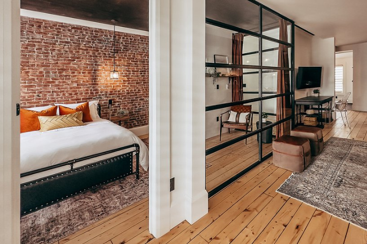 Rustic bedroom with exposed brick at <yoastmark class=