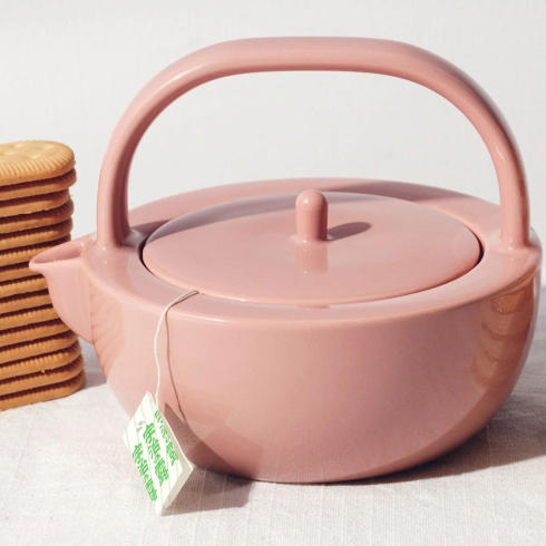 A pink ceramic teapot