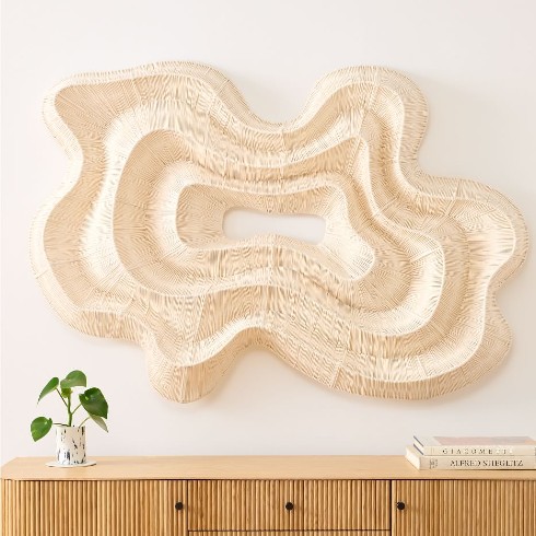 A sculptural wood wall piece