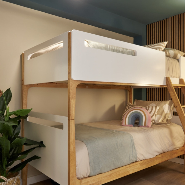 White bunk beds in a kids room