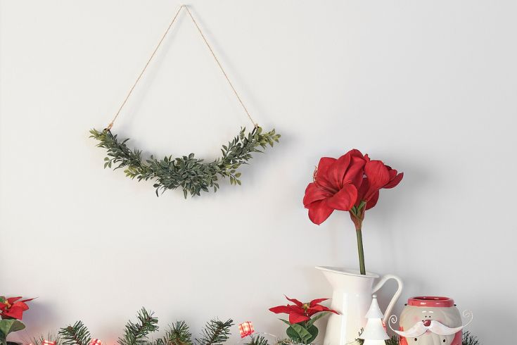 Faux wreath hanging on wall