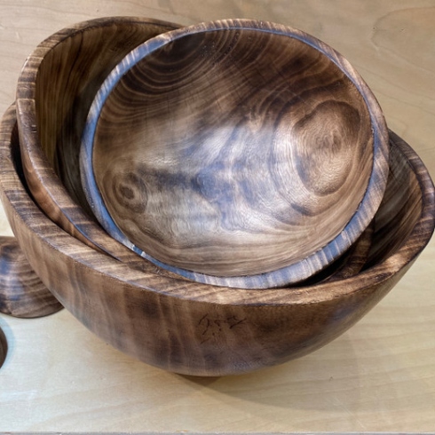 A burned jacaranda wood salad bowl set