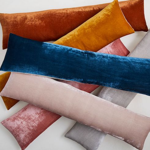 Gift idea - A stack of brightly coloured Lush Velvet Oversized Lumbar Pillows by West Elm