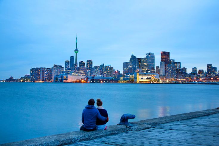 A couple admiring the Toronto skyline