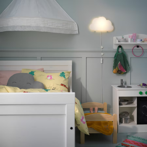 a cloud-shaped lamp in a kid's bedroom