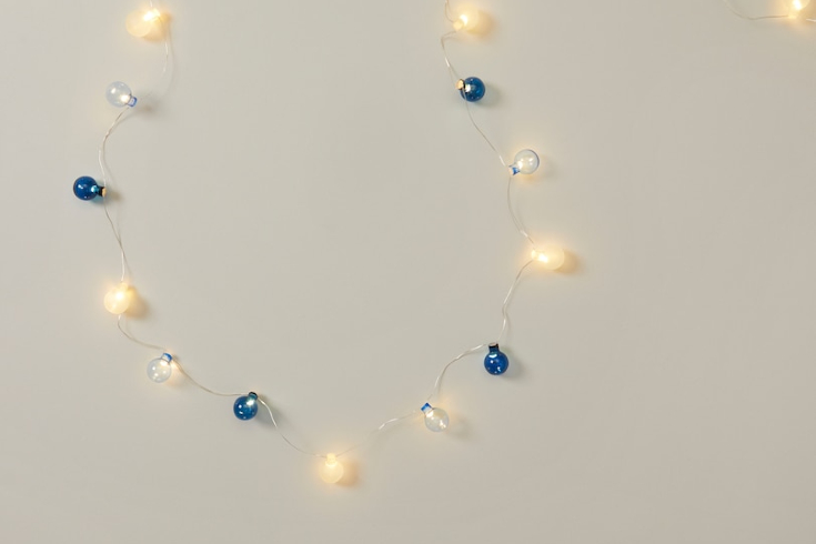 A string of lights with three colours of round bulbs