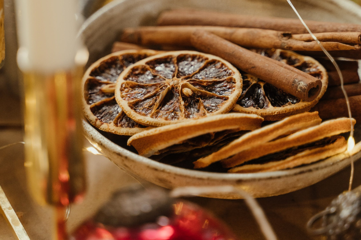 Dried fruit and cinnamon sticks on table