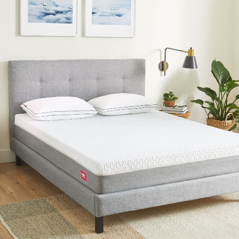 A fresh Endy mattress on a grey fabric bedframe