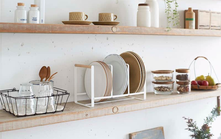 Organized dishes on a kitchen shelf