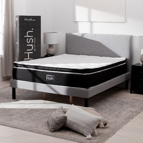 A luxuriously thick new Hush Arctic mattress in a neutral grey bedroom
