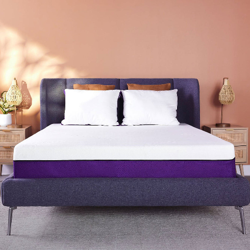 A dark grey, purple and white Polysleep mattress on a grey bedframe